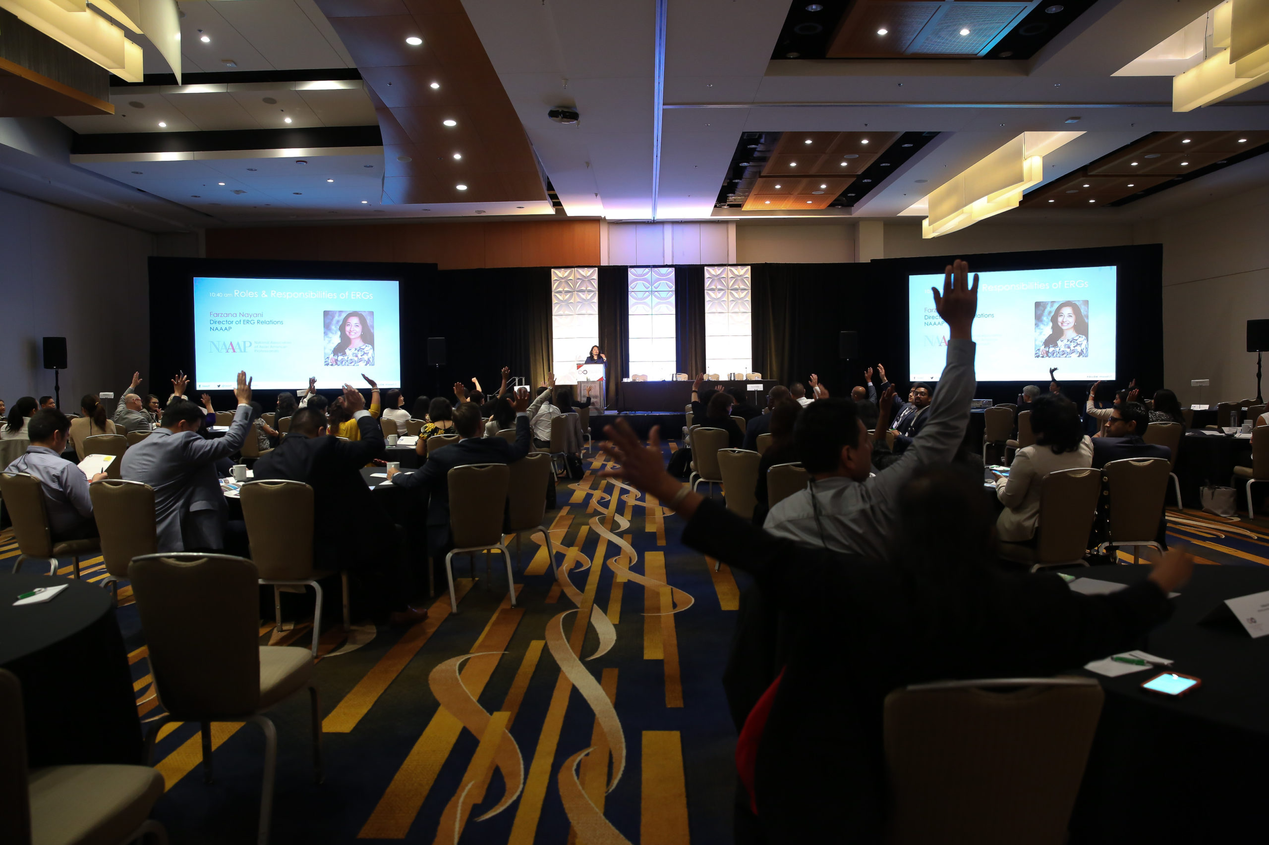 A room full of professionals learning